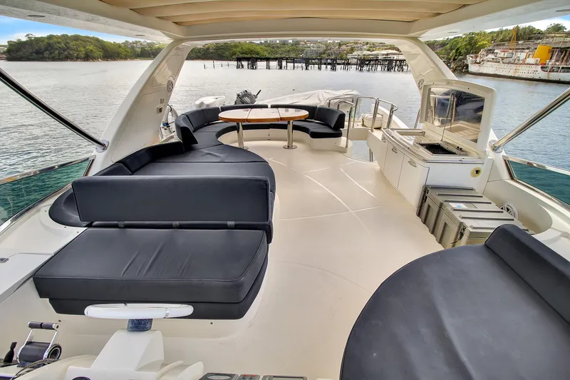  Yacht Photos Pics Luxurious 2006 Azimut 75 yacht deck with elegant seating and scenic waterfront view.