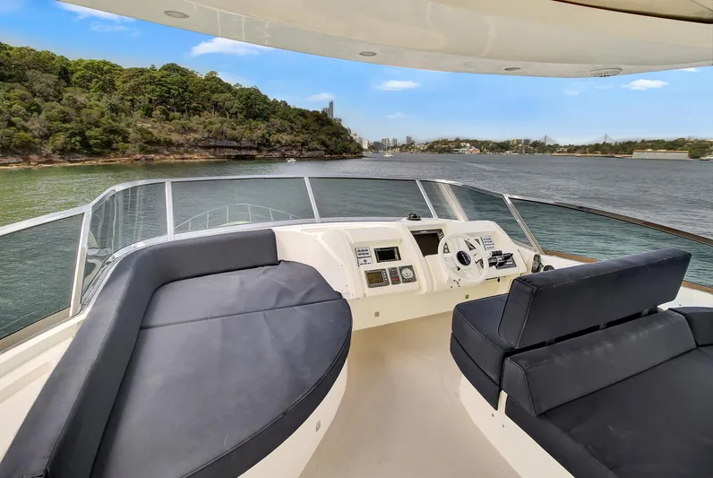  Yacht Photos Pics Flybridge view of 2006 Azimut 75 yacht with luxurious seating and scenic water backdrop.