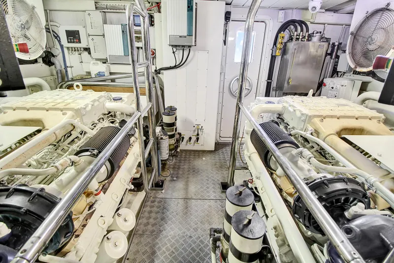  Yacht Photos Pics Engine room of a 2006 Azimut 75 yacht, featuring dual engines and mechanical equipment.