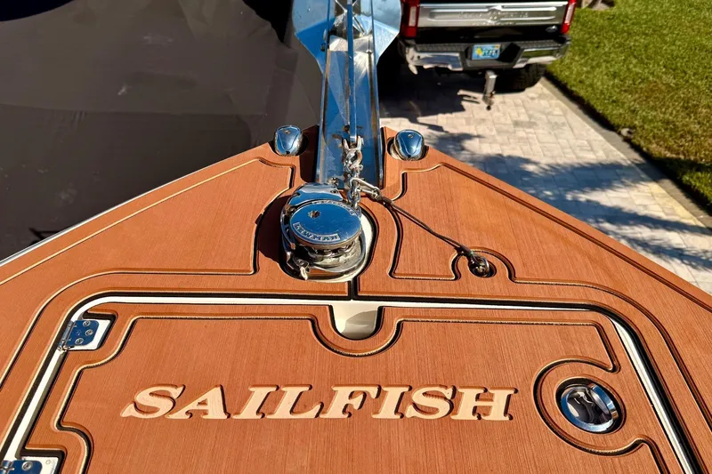  Yacht Photos Pics 2016 Sailfish 290 CC boat deck with anchor and engraved logo.