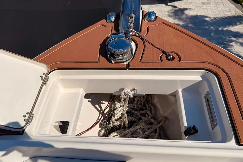  Yacht Photos Pics Open anchor locker on 2016 Sailfish 290 CC boat, showing ropes and winch.