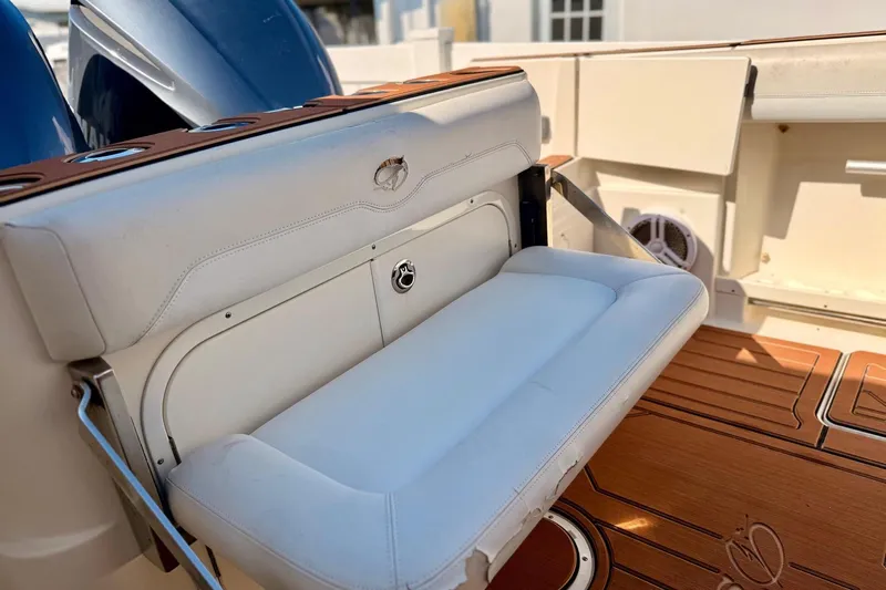  Yacht Photos Pics 2016 Sailfish 290 CC boat with foldable white seat and teak flooring.