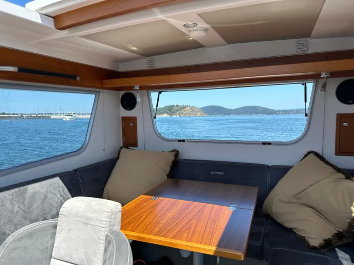 Sisu Yacht Photos Pics Interior of 2020 Sargo 31 boat with scenic ocean view through windows.