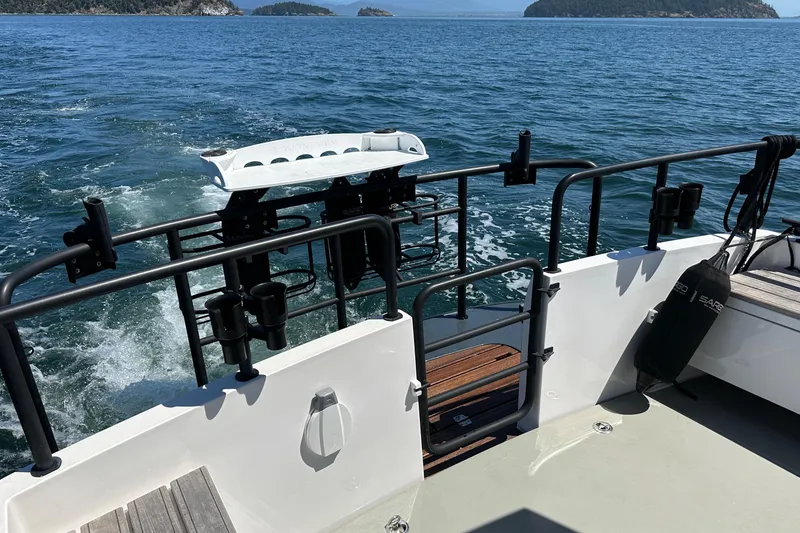 Sisu Yacht Photos Pics Sargo 31 boat (2020) cruising on open water with scenic island views.