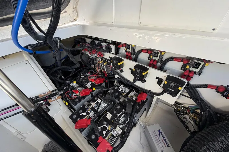 Sea Jay Yacht Photos Pics Electrical system of 2023 Sea Ray Sundancer 320 Outboard, showcasing batteries and wiring.