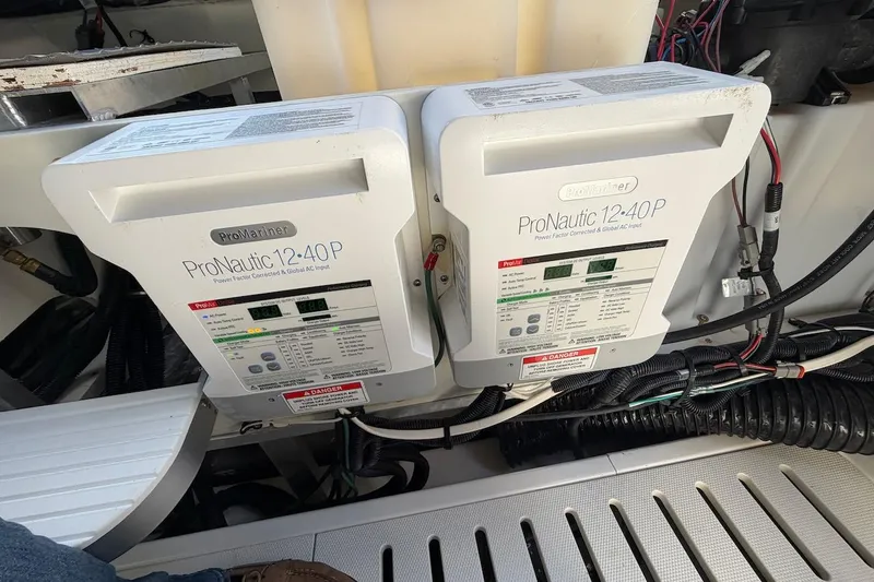 Sea Jay Yacht Photos Pics ProNautic 12-40P chargers in 2023 Sea Ray Sundancer 320 Outboard boat engine compartment.