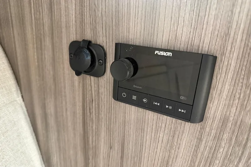 Sea Jay Yacht Photos Pics Fusion audio system on 2023 Sea Ray Sundancer 320 Outboard boat interior.