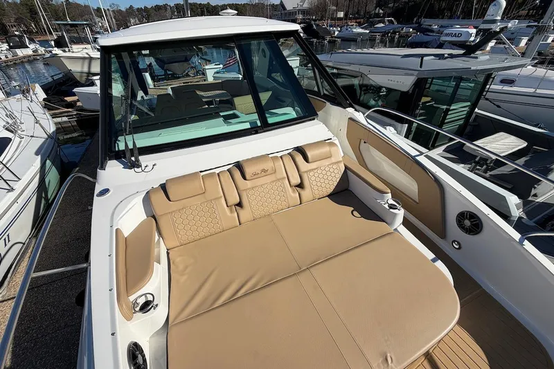 Sea Jay Yacht Photos Pics 2023 Sea Ray Sundancer 320 Outboard with tan seating, docked at a marina.