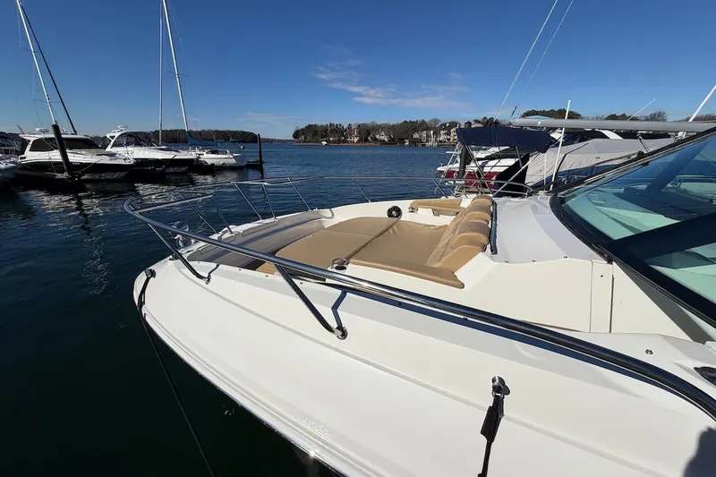 Sea Jay Yacht Photos Pics 2023 Sea Ray Sundancer 320 Outboard docked, showcasing sleek design and spacious deck.