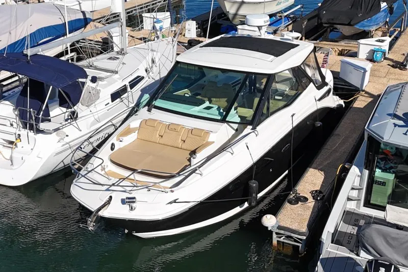 Sea Jay Yacht Photos Pics 2023 Sea Ray Sundancer 320 Outboard docked at marina, featuring sleek design and spacious deck.