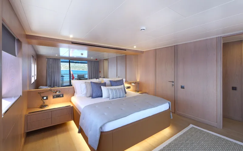 Tortura Yacht Photos Pics Luxurious bedroom interior of 2024 Aegean Yacht Explorer M26 with modern design and elegant furnishings.