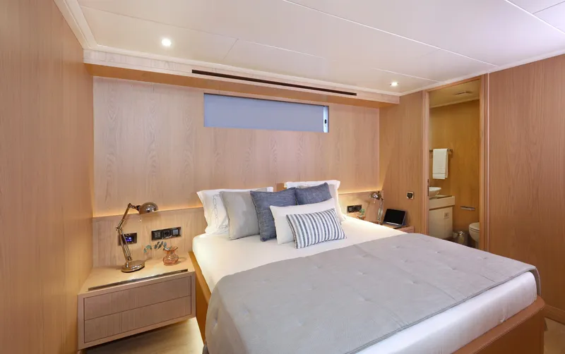 Tortura Yacht Photos Pics Luxurious bedroom interior of 2024 Aegean Yacht Explorer M26 with modern design and cozy ambiance.