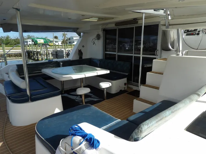  Yacht Photos Pics Spacious deck of 2014 Leopard 48 yacht with seating and table.