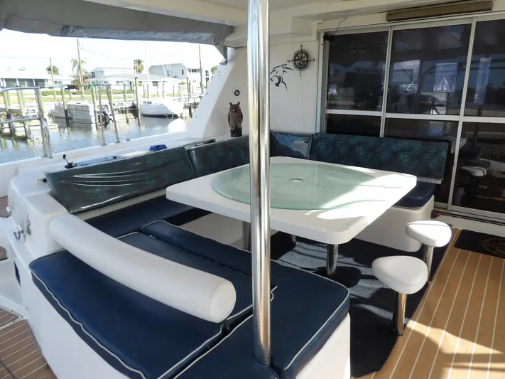  Yacht Photos Pics Leopard 48 yacht interior with seating area and table, 2014 model.