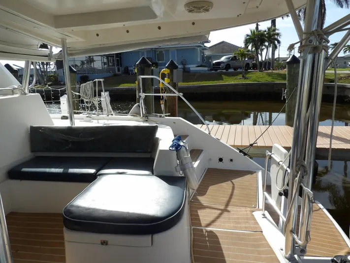  Yacht Photos Pics Leopard 48 yacht deck with seating, docked by waterfront homes, 2014 model.