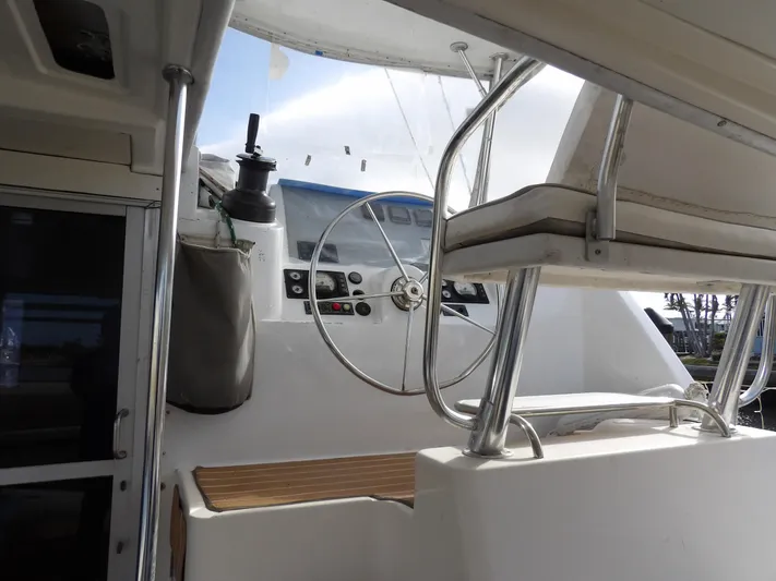  Yacht Photos Pics Interior view of 2014 Leopard 48 yacht helm with steering wheel and controls.