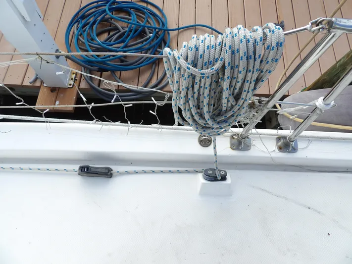  Yacht Photos Pics Coiled rope on Leopard 48 sailboat deck, 2014 model, with dock in background.