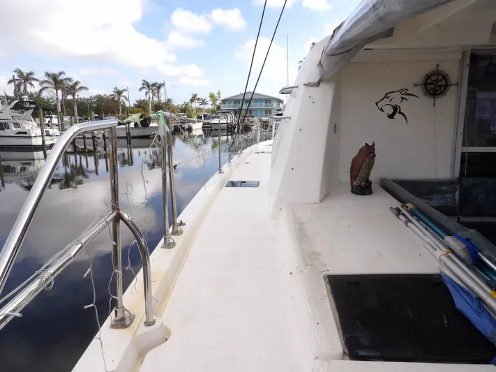  Yacht Photos Pics Leopard 48 yacht docked at marina, 2014 model, with clear skies and palm trees.