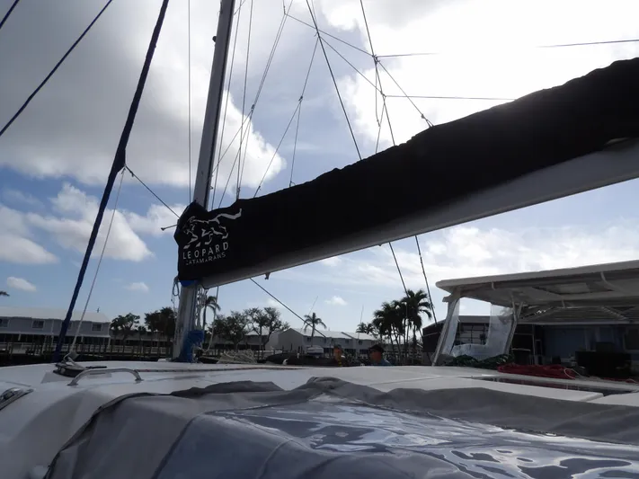  Yacht Photos Pics Leopard 48 sailboat from 2014 docked under a partly cloudy sky.