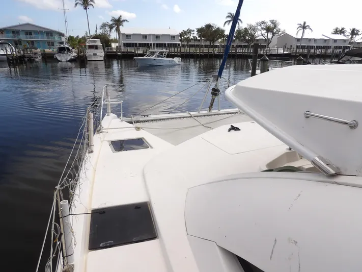  Yacht Photos Pics Leopard 48 catamaran docked in a marina, 2014 model, with waterfront view.