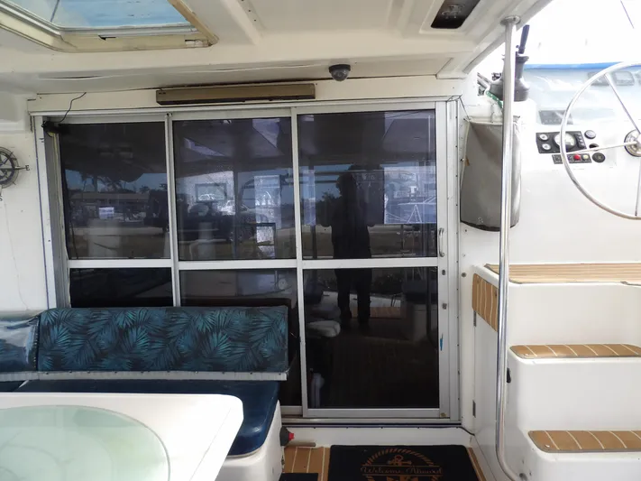  Yacht Photos Pics Interior view of a 2014 Leopard 48 yacht with seating and stairs.