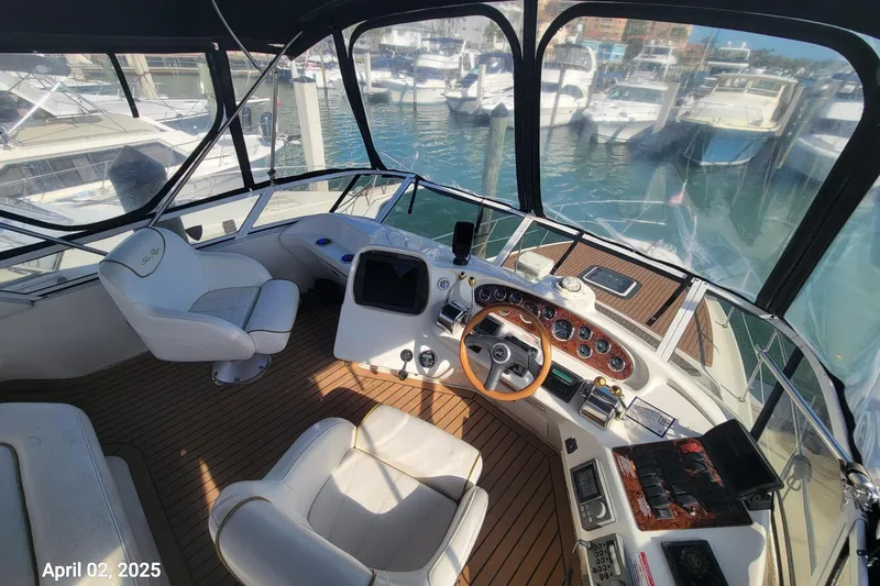 'next Week' Yacht Photos Pics Cockpit of 2000 Sea Ray 380 Aft Cabin yacht with marina view, dated April 02, 2025.