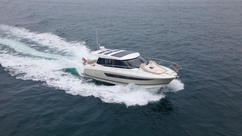 Dark Side Yacht Photos Pics 2017 Jeanneau NC11 yacht cruising on open water.
