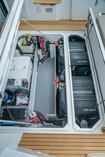 Dark Side Yacht Photos Pics Engine compartment of 2017 Jeanneau NC11 boat with Volvo Penta engines and equipment.