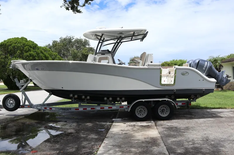  Yacht Photos Pics 2016 Sea Fox Commander 288 boat on trailer, parked outdoors.