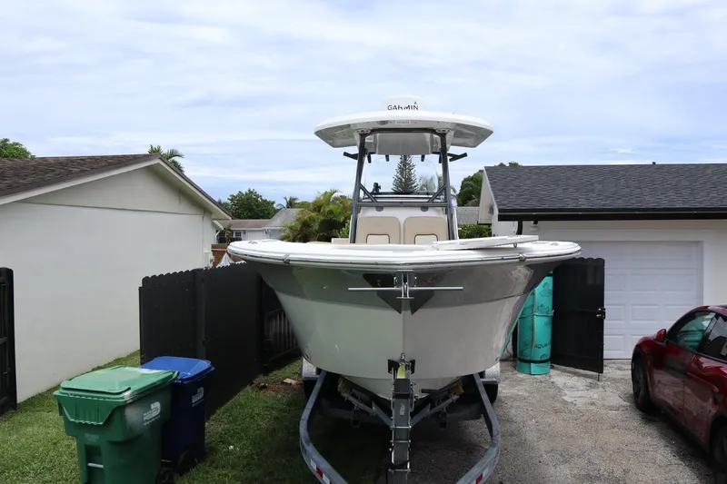  Yacht Photos Pics 2016 Sea Fox Commander 288 boat on trailer in residential driveway.