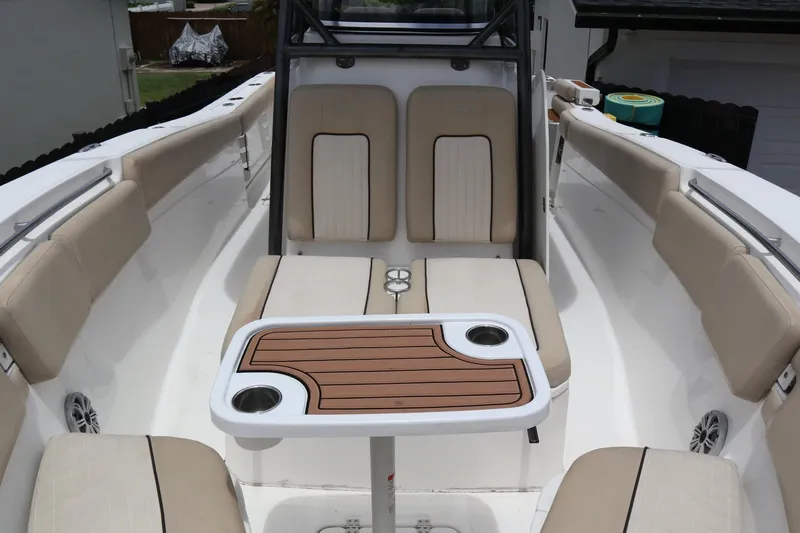  Yacht Photos Pics 2016 Sea Fox Commander 288 boat interior with beige seating and a central table.