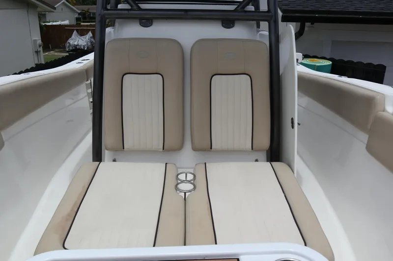  Yacht Photos Pics 2016 Sea Fox Commander 288 boat interior with beige seating and cup holders.