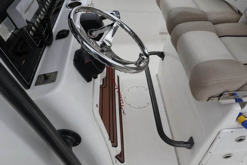  Yacht Photos Pics 2016 Sea Fox Commander 288 boat helm with steering wheel and seating.