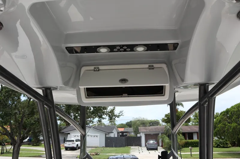  Yacht Photos Pics 2016 Sea Fox Commander 288 boat interior with overhead storage and control panel.