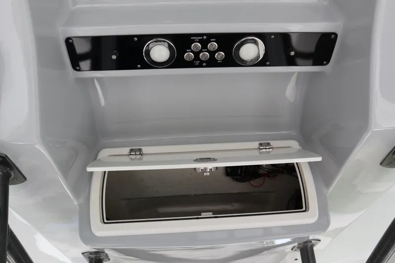  Yacht Photos Pics 2016 Sea Fox Commander 288 console with open storage compartment and control panel.