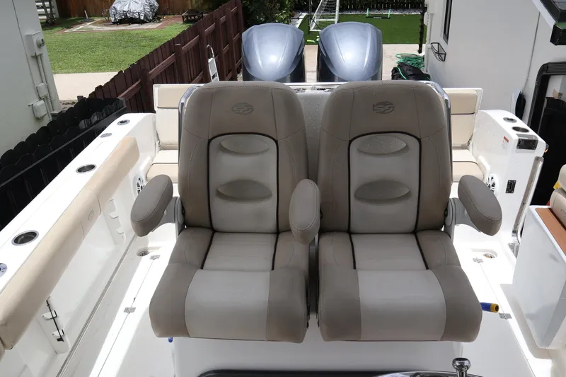 Yacht Photos Pics 2016 Sea Fox Commander 288 boat seats with armrests, featuring dual outboard motors.