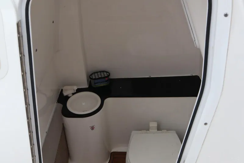  Yacht Photos Pics 2016 Sea Fox Commander 288 boat interior bathroom with sink and toilet.