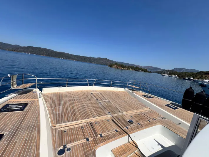 Ns03445 Yacht Photos Pics Luxurious 2022 Lagoon SIXTY 7 yacht deck with scenic ocean and mountain views.