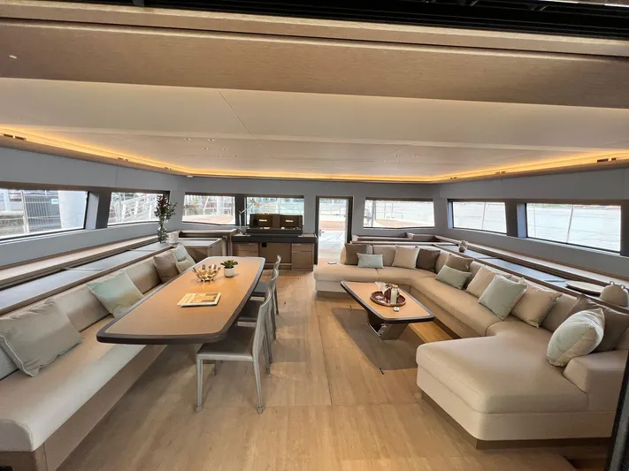 Ns03445 Yacht Photos Pics Luxurious interior of 2022 Lagoon SIXTY 7 yacht with elegant seating and dining area.