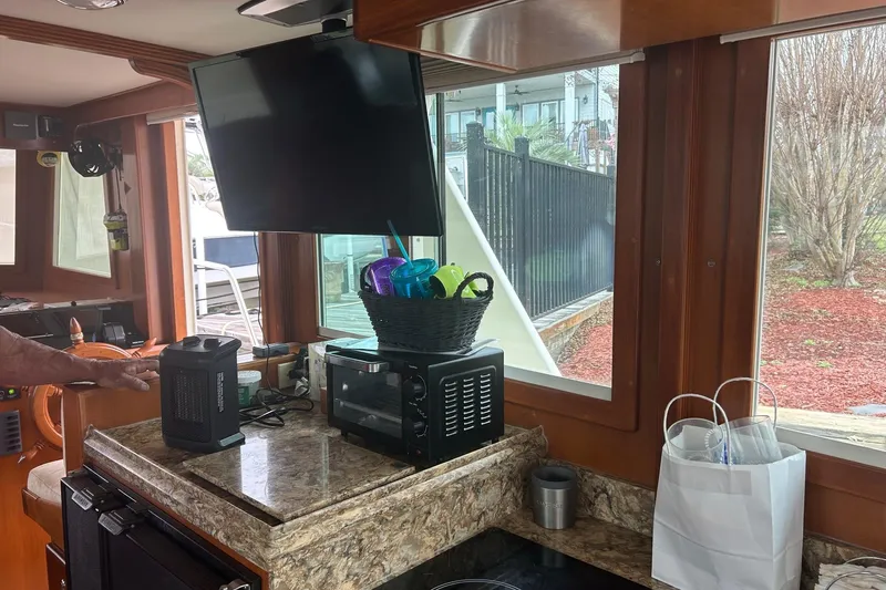  Yacht Photos Pics 2006 Mariner Orient yacht interior with kitchen appliances and large windows.