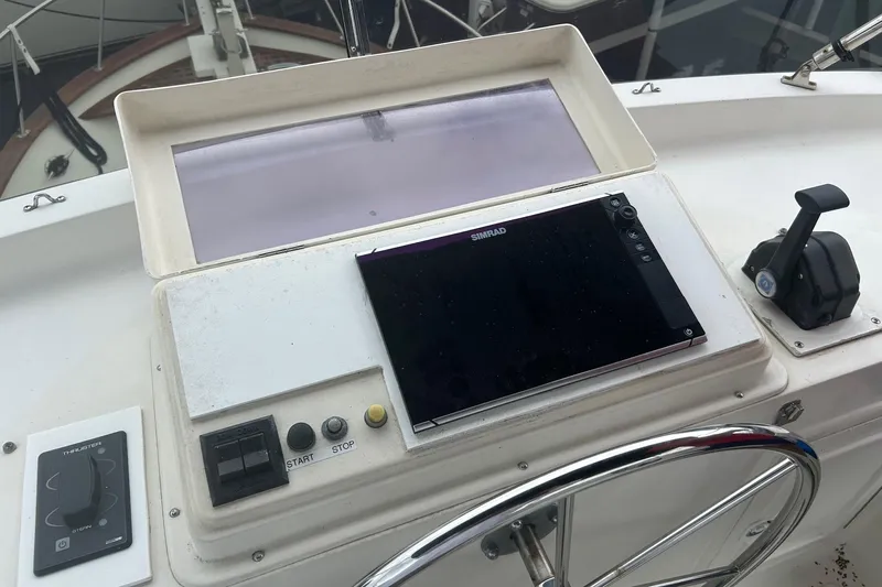  Yacht Photos Pics 2006 Mariner Orient boat helm with Simrad display and control panel.