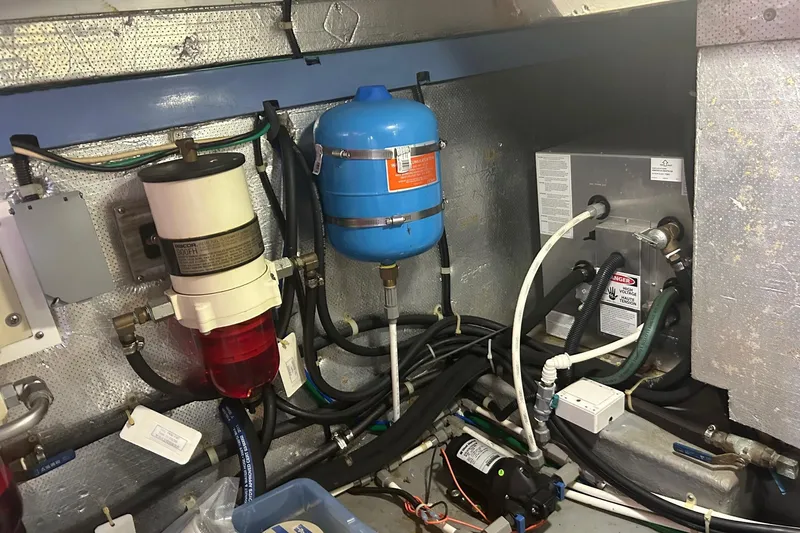  Yacht Photos Pics Engine room of a 2006 Mariner Orient boat with various mechanical components.