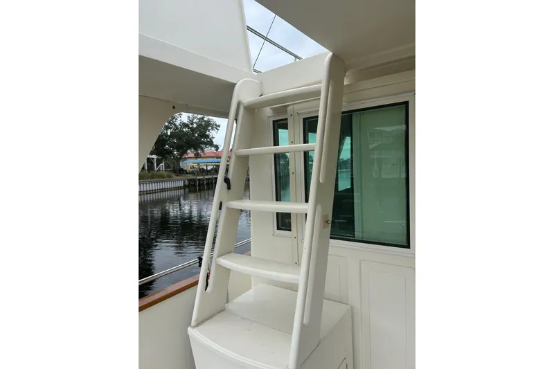  Yacht Photos Pics White ladder on 2006 Mariner Orient boat, near window and water view.