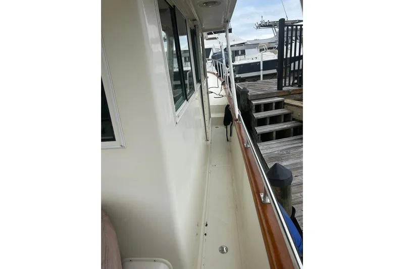  Yacht Photos Pics 2006 Mariner Orient boat docked, showing side deck and railing.