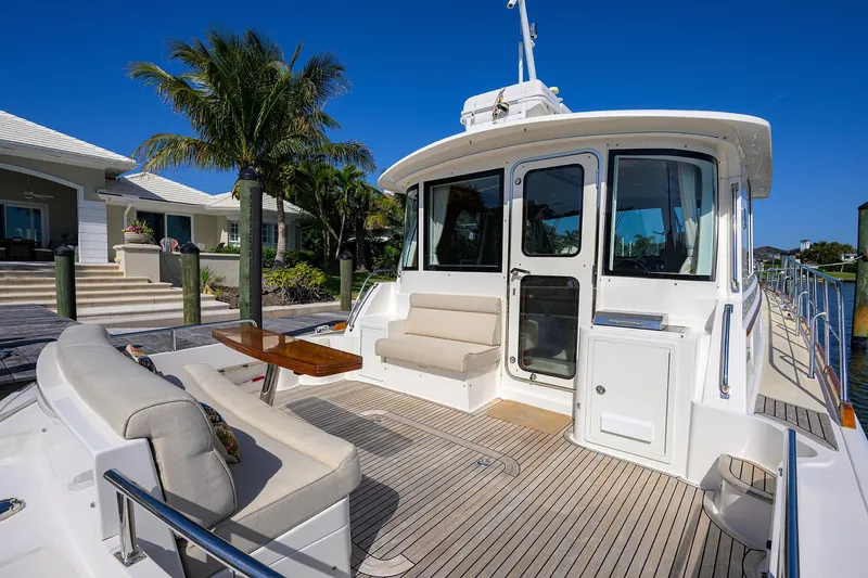 Seabird Yacht Photos Pics 2014 Grand Banks 46 Eastbay SX yacht with spacious deck and seating area.