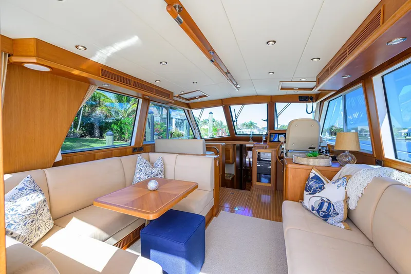 Seabird Yacht Photos Pics Luxurious interior of 2014 Grand Banks 46 Eastbay SX yacht with elegant seating and wood finishes.