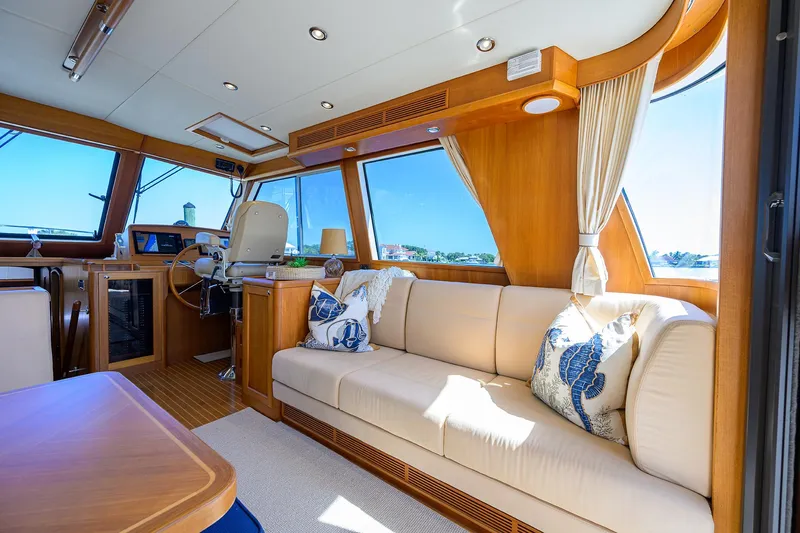Seabird Yacht Photos Pics Luxurious interior of 2014 Grand Banks 46 Eastbay SX yacht with plush seating.