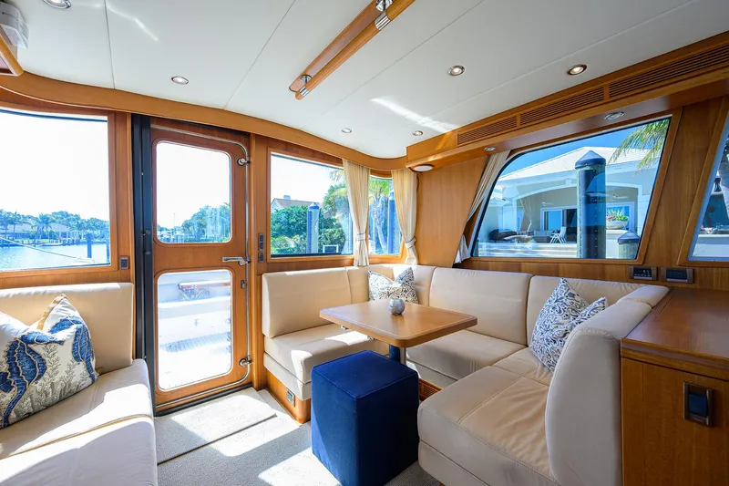 Seabird Yacht Photos Pics Interior of 2014 Grand Banks 46 Eastbay SX yacht with elegant seating and wooden accents.