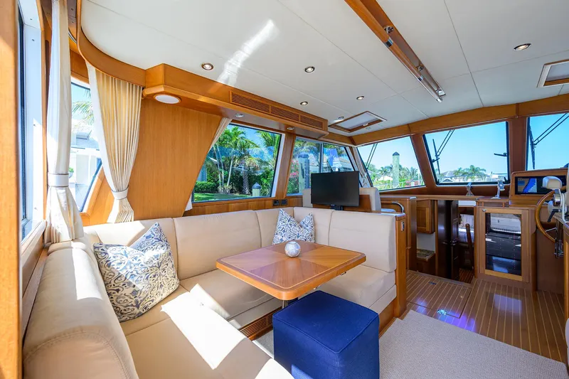 Seabird Yacht Photos Pics Luxurious interior of 2014 Grand Banks 46 Eastbay SX yacht with elegant seating and wood finishes.