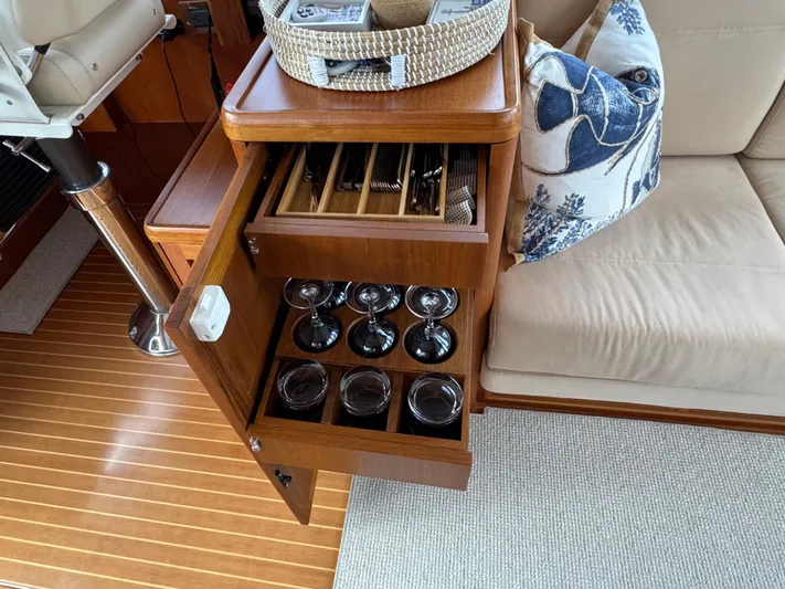 Seabird Yacht Photos Pics Luxurious interior of 2014 Grand Banks 46 Eastbay SX with glassware storage.